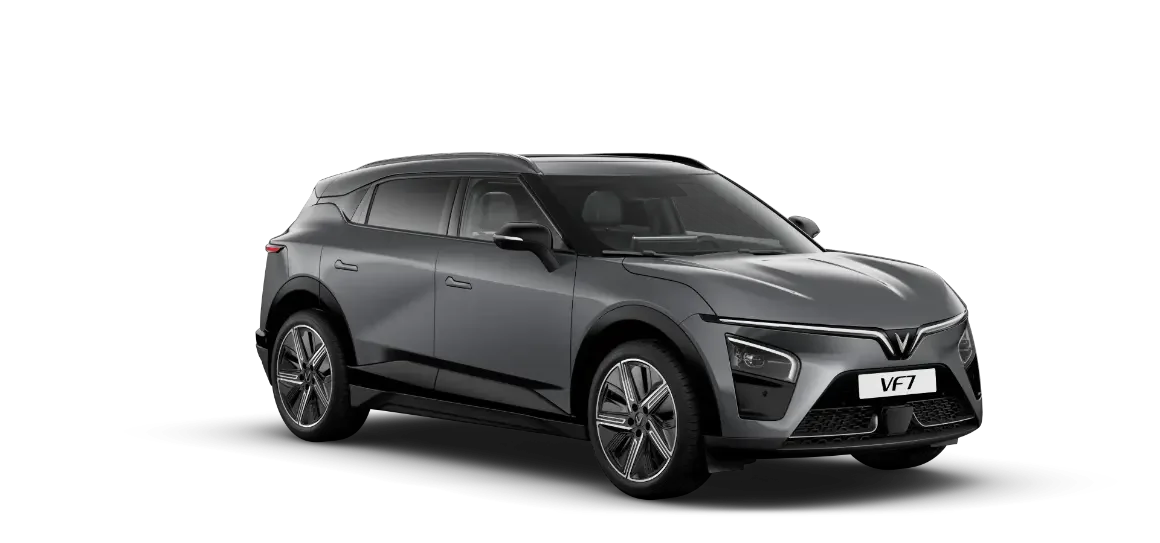 VinFast VF 7 warna Neptune Grey, mobil listrik modern yang menampilkan kesan tangguh dengan velg sport 20 inci dan desain gagah