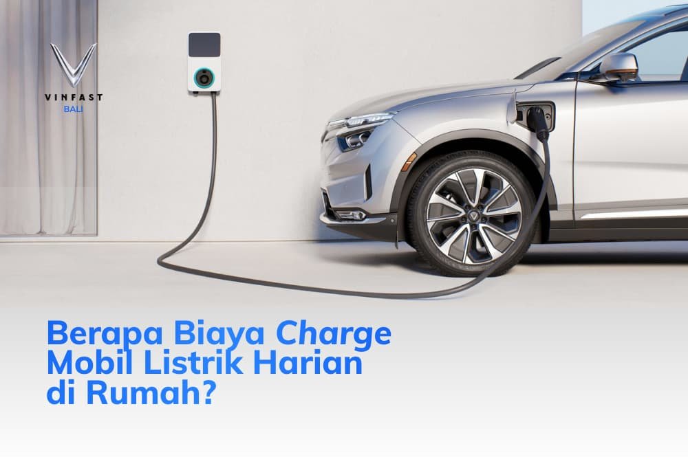 Mobil listrik VinFast abu-abu mengisi daya dengan charger dinding di rumah, menyoroti biaya charge mobil listrik harian yang efisien.